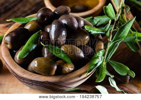 Olives And Olive Oil In Olive Wooden Bowls, Olive Tree Branch