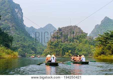 International Tourists Traveling On Local Vietnamese Small Boat