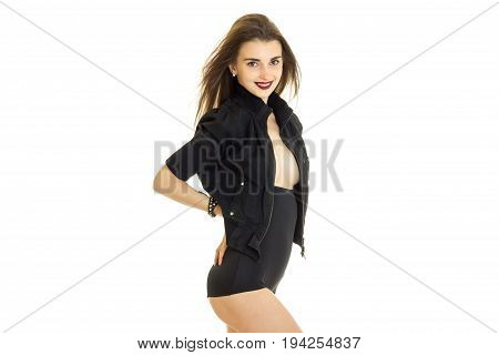 attractive slender Lady in black suit poses on camera isolated on white background