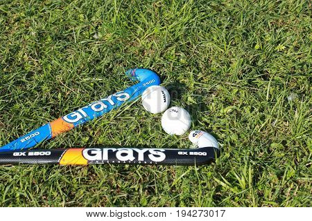 hockey sticks and balls for hockey grass