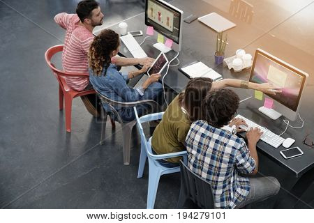 Upper view of start-up people working in open co-working office