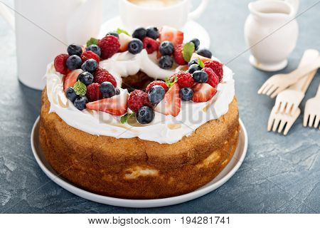 Angel food cake with whipped cream and fresh berries