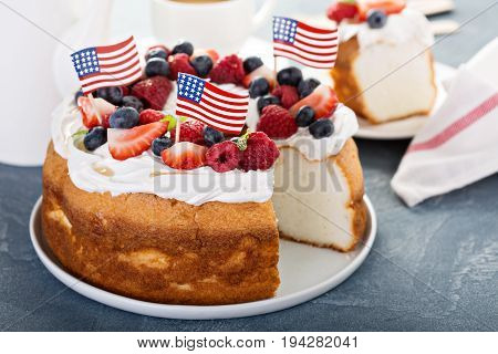 Angel food cake with whipped cream and fresh berries