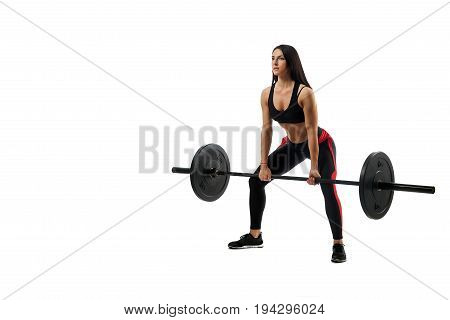 Young athletic woman deadlift craving with a barbell on a white isolated background position of a half-breed