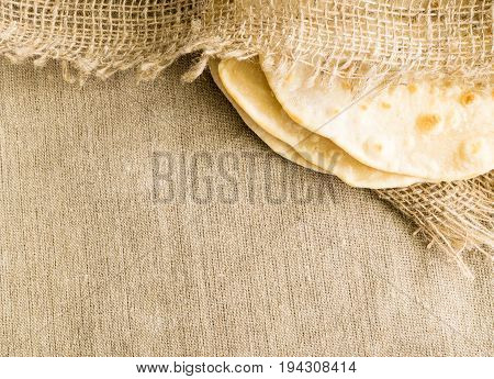 Flat Bread On A Burlap Background