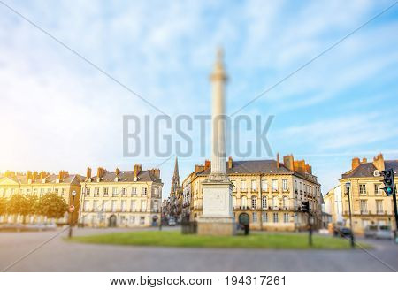 Street view on the Marechal-Foch sqaure with Louis column during the sunset in Nantes city in France