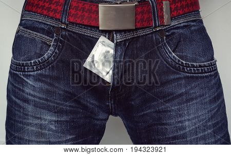 Condom Close To Zip Of Blue Jeans