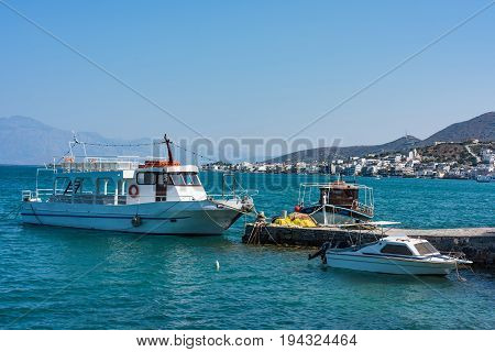 Boats In A Blue Sea, Elounda Coast Of Crete Island In Greece