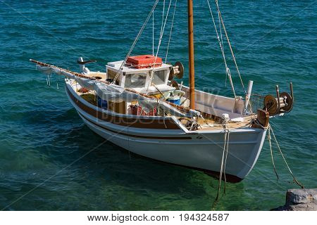 Fishing Boat In A Blue Sea, Elounda Coast Of Crete Island In Greece