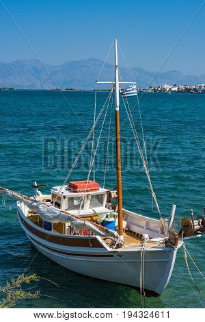 Fishing Boat In A Blue Sea, Elounda Coast Of Crete Island In Greece