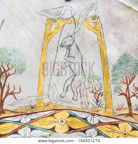 geese hanging a fox in the gallows a medieval gothic fresco in Vinderslev church Denmark June 22 2017