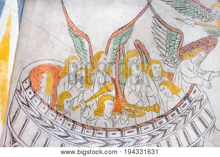 Angels playing medieval gothic fresco in Vinderslev church Denmark June 22 2017