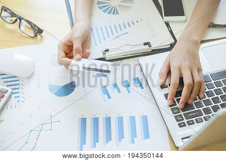Woman's Hands Holding A Credit Card And Using Smart Phone For Online Shopping.