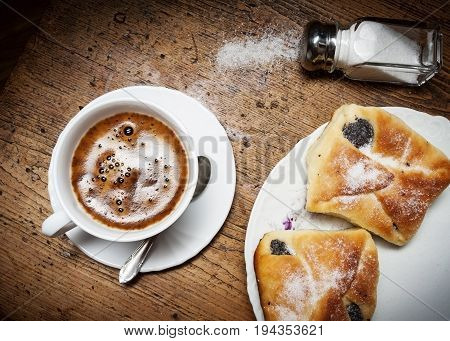 a cup of coffee and cakes - close up