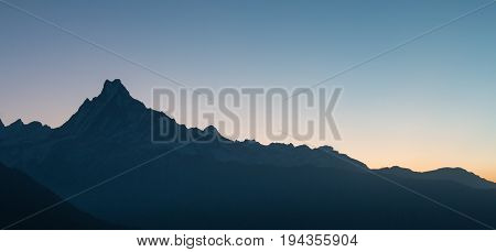 the sun is rising on the Machhapuchhre mountain in Nepal feeling calm and beautiful nature in the morning