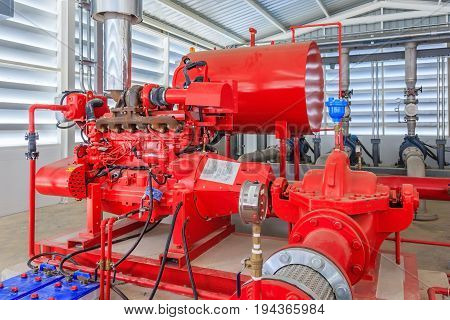 Industrial fire pump station for water sprinkler piping and fire alarm control system. Pipelines water pump valves manometers.