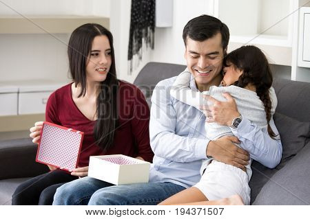 Little Girl Give A Present To Dady At Home With Happy Emotion Happy Family Concept.