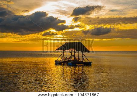 Beautiful Sunset On The Beach. Silhouettes Of Pavilions. Pandan, Panay, Philippines.