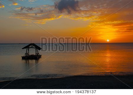 Beautiful Sunset On The Beach. The Silhouette Of The Gazebo. Pandan, Panay, Philippines.