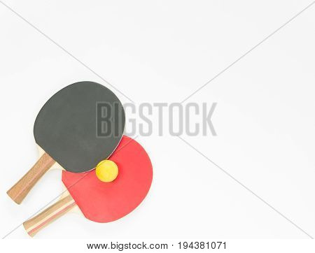 Sport background. Red and black ping-pong rackets and balls. Flat lay top view