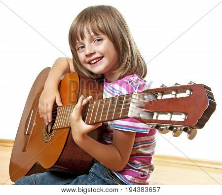 little girl playing guitar - white background