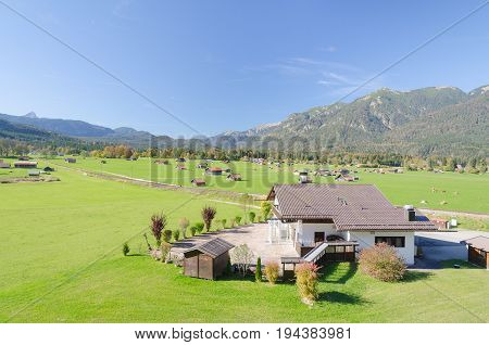 View of Alpine highland pasture in valley at foothills of Bavarian Alps