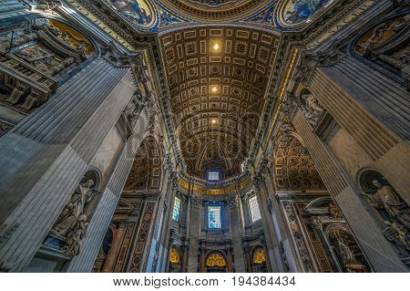 VATICAN ROME ITALY - JUNE 1 2017: Panoramic view of interiors and architectural details of St Peter Basilica in the Vatican. Renaissance church and the papal enclave.