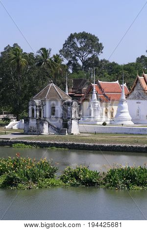 small white Temple by the river in small province, Thailand. a peaceful good environment for meditation.