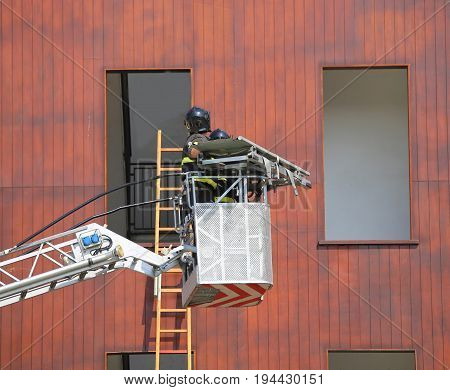 Bucket Truck With Firefighters During Exercise In The Firehouse