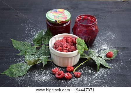 Ripe and tasty raspberries on a wooden background. Raspberries on wooden table .Fresh , vitamins healthy food vegan ingredients.