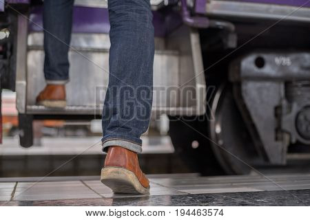 man traveler with backpacker at trainstation travel concept