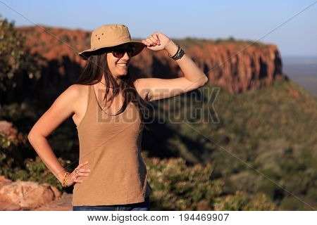 Girl Using Hat At An African Landscape. Waterberg Plateau, Namibia