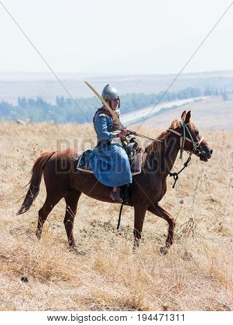 Tiberias Israel July 01 2017 : Participants in the reconstruction of Horns of Hattin battle in 1187 participate in the battle rides on the battlefield near TIberias Israel