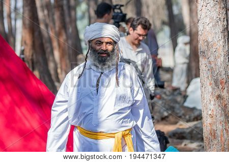 Tiberias Israel July 01 2017 : Participant in the reconstruction of Horns of Hattin battle in 1187 goes through the camp before the campaign near Tiberias Israel