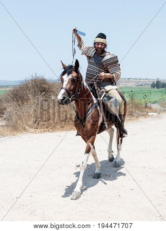 Tiberias Israel July 01 2017 : Participants in the reconstruction of Horns of Hattin battle in 1187 left the camp on horseback and go to the battle site near TIberias Israel