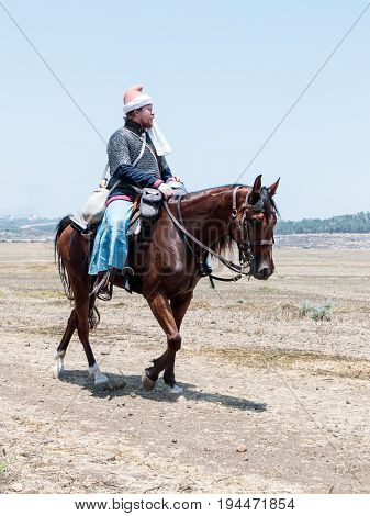 Tiberias Israel July 01 2017 : Participants in the reconstruction of Horns of Hattin battle in 1187 left the camp on horseback and go to the battle site near TIberias Israel