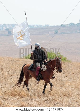 Tiberias Israel July 01 2017 : Participants in the reconstruction of Horns of Hattin battle in 1187 moving around the battlefield near Tiberias Israel