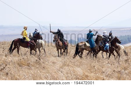 Tiberias Israel July 01 2017 : Participants in the reconstruction of Horns of Hattin battle in 1187 participate in the battle on horseback on the battlefield near TIberias Israel