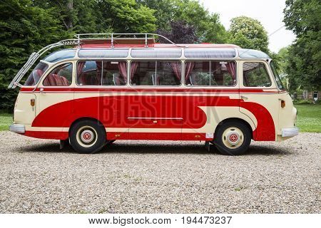 Rouen France - July 1 2017. Old bus collection withe and red first registration in 1959 still drive Setra brand. In a park outdoor ready to go.