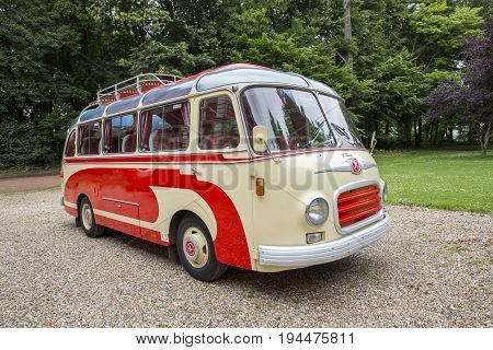 Rouen France - July 1 2017. Old bus collection withe and red first registration in 1959 still drive Setra brand. In a park outdoor ready to go.