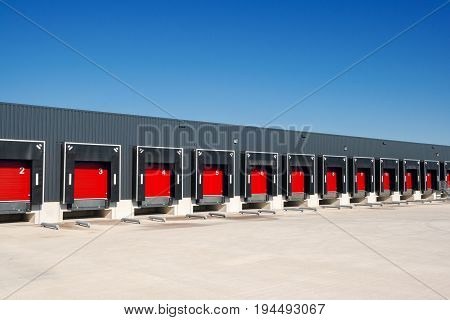 Row of loading docks with shutter doors at a warehouse