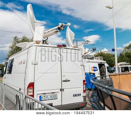 STRASBOURG FRANCE - JUN 30 2017: RTL N:TV TV Media Television Trucks with multiple Satellite parabolic antennas and fiber optic cables preparing to report live the official European Ceremony of Honour for Dr. Helmut Kohl at European Parliament