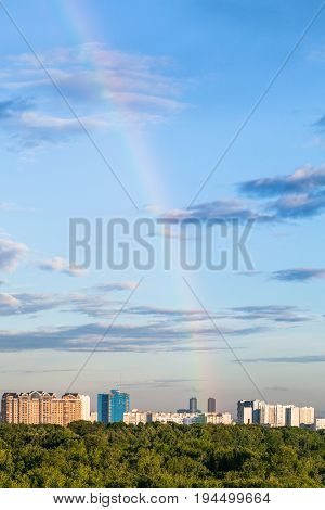 Rainbow In Blue Evening Sky Over Apartment Houses
