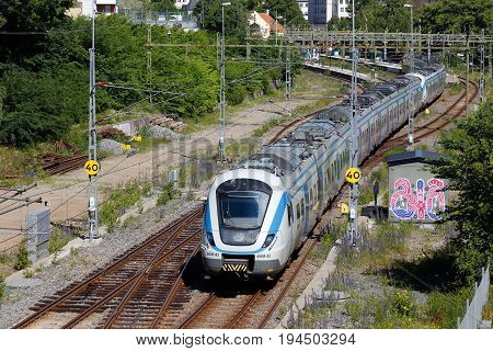 Sodertalje Sweden - June 28 2017: One commuter public transportation train class X60 in service for SL arrives the Sodertalje Centrum station.