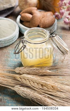 Nature cosmetics handmade preparation with essential oils and ancient minerals of perfume skincare creams soaps from fresh and dried roses wheat almond nuts green clay powder in French artisanal boutique home style