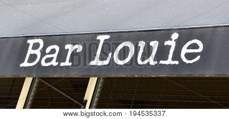 PERRYSBURG OH - JUN 25: A sign for Bar Louie in Perrysburg OH is shown here on June 25 2017. There are more than 110 locations in the United States.