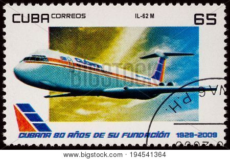 Moscow Russia - January 18 2017: A stamp printed in Cuba shows passenger airliner Ilyushin IL-62M series 