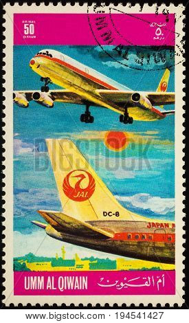 Moscow Russia - July 10 2017: A stamp printed in Umm al-Quwain shows passenger airliner Douglas DC-8 of JAL (Japan Airlines) series 