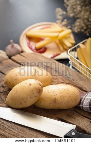 Deep Fried Potato Slice And Potato On Wooden Baord For Cooking