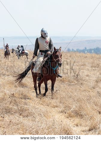 Tiberias Israel July 01 2017 : Participants in the reconstruction of Horns of Hattin battle in 1187 moving around the battlefield near Tiberias Israel
